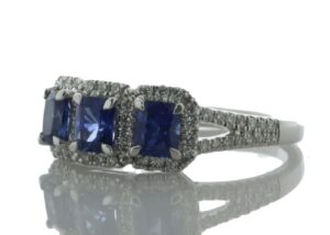 18ct White Gold Three Stone Emerald Cut Sapphire And Diamond Ring (S 1.20) 0.29