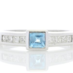 9ct White Gold Channel Set Diamond and Princess Cut Blue Topaz Ring 0.20 Carats