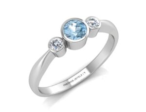 9ct White Gold Three Stone Diamond And Blue Topaz Ring 0.10 Carats