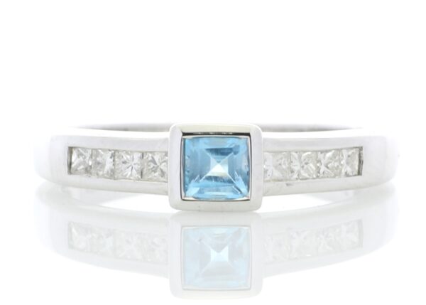 9ct White Gold Channel Set Diamond and Princess Cut Blue Topaz Ring 0.20 Carats