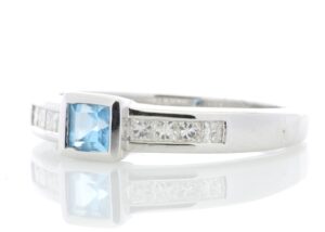 9ct White Gold Channel Set Diamond and Princess Cut Blue Topaz Ring 0.20 Carats